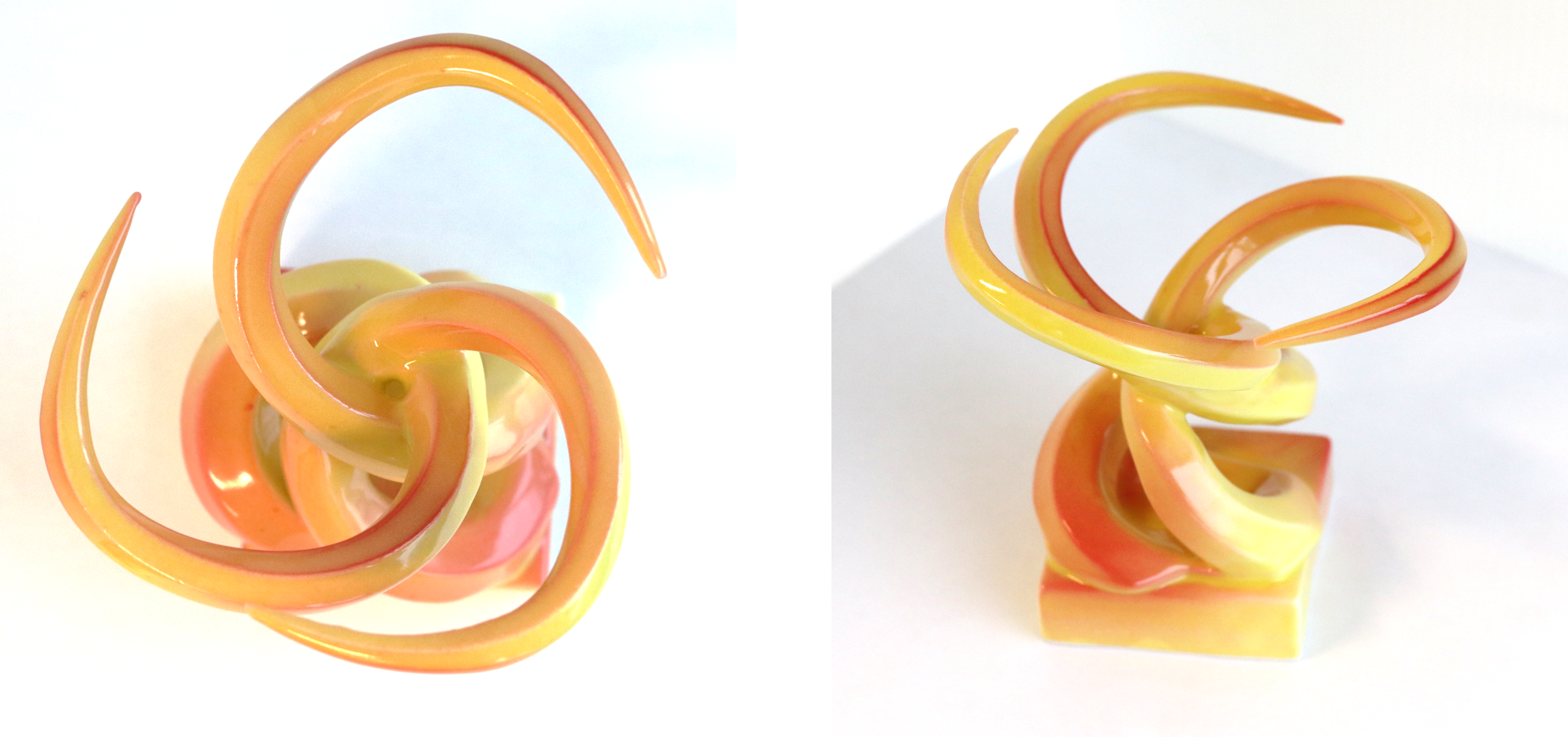 top and side view of yellow and orange spiral ceramic sculpture